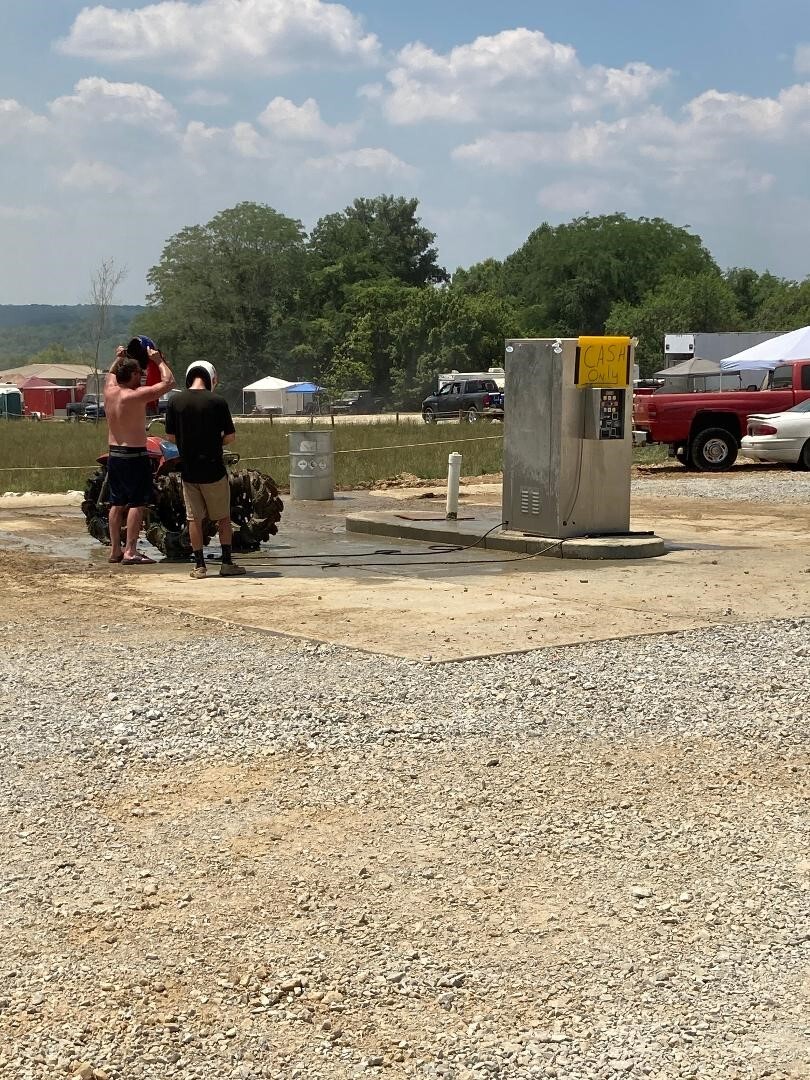 2 men washing a vehicle